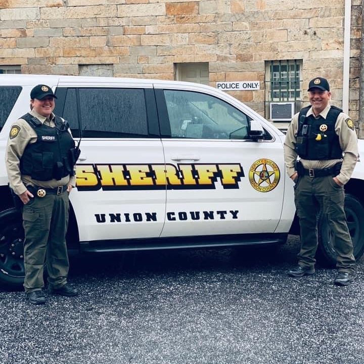 Union County Sheriff’s Officers by patrol car